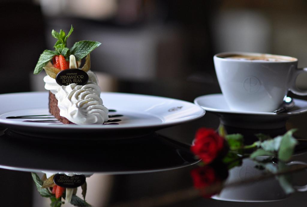 Ambassador Zlata Husa Prague Ngoại thất bức ảnh A chocolate cake with a cup of coffee